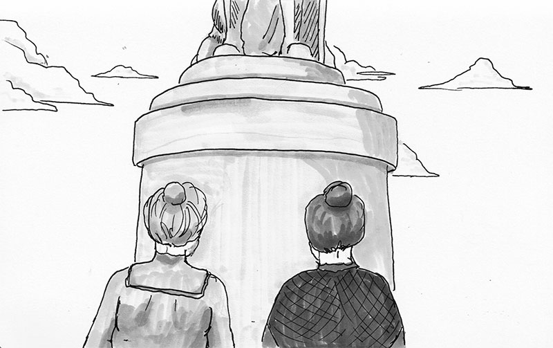 two women looking up at the statue of Nelson in Dublin Ireland